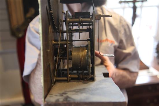 Major Scholfield of Manchester. An early 19th century flame mahogany cased eight day longcase clock, 8ft 6in.